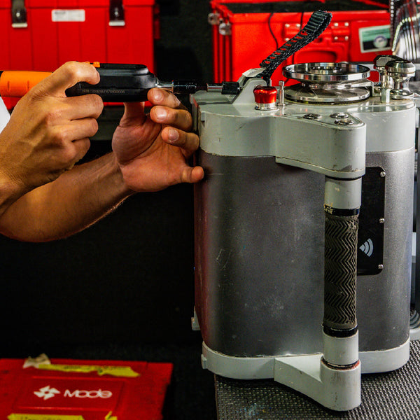 MODE authorised technician servicing a Smart Spider powered ascender